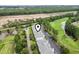 Scenic aerial view of a condo complex featuring parking, greenery, a pond, and partial golf course views at 1009 World Tour Blvd. # 105, Myrtle Beach, SC 29579