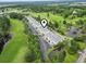 Scenic aerial view of condo complex with manicured lawns, parking, trees, and golf course views at 1009 World Tour Blvd. # 105, Myrtle Beach, SC 29579