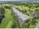 Scenic aerial view of condo complex with manicured lawns, parking, trees, and golf course views at 1009 World Tour Blvd. # 105, Myrtle Beach, SC 29579