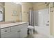 Bright bathroom with a single sink vanity, granite countertop, a toilet, and a shower with curtain at 1009 World Tour Blvd. # 105, Myrtle Beach, SC 29579