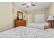 Bedroom showcasing two beds, wooden dresser, a closet, and a ceiling fan for added comfort at 1009 World Tour Blvd. # 105, Myrtle Beach, SC 29579