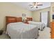 Cozy bedroom with two beds, complemented by a ceiling fan and natural light from a window at 1009 World Tour Blvd. # 105, Myrtle Beach, SC 29579