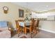 Cozy dining room with table set for six adjacent to kitchen at 1009 World Tour Blvd. # 105, Myrtle Beach, SC 29579