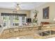 Kitchen counter and sink overlooking the dining and living area, with a view to the backyard at 1009 World Tour Blvd. # 105, Myrtle Beach, SC 29579
