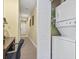 Hallway with a laundry closet that features a stackable washer and dryer at 1009 World Tour Blvd. # 105, Myrtle Beach, SC 29579