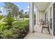 Relaxing porch seating with views of the well-manicured lawn and landscaping at 1009 World Tour Blvd. # 105, Myrtle Beach, SC 29579