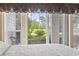 View from the bedroom window showcasing lush greenery and the surrounding golf course at 1009 World Tour Blvd. # 105, Myrtle Beach, SC 29579