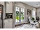 Light and airy entryway features double doors with wreaths and convenient access to a modern kitchen at 101 Karlie Ln., Aynor, SC 29511