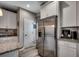 Well-lit kitchen featuring stainless steel refrigerator, granite countertops, and white cabinetry at 101 Karlie Ln., Aynor, SC 29511