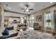 Bright living room with hardwood floors, ceiling fan, and an open layout with easy access to the kitchen at 101 Karlie Ln., Aynor, SC 29511