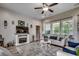 Relax in this living space with a fireplace, large windows and a ceiling fan for added comfort at 101 Karlie Ln., Aynor, SC 29511
