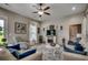 Bright living space with hardwood floors, fireplace, bright windows and a ceiling fan at 101 Karlie Ln., Aynor, SC 29511