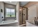 Bright bathroom showcasing a bathtub and an adjacent glass shower at 101 Karlie Ln., Aynor, SC 29511