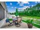 Outdoor patio with seating, an umbrella, grill, and a landscaped backyard at 101 Karlie Ln., Aynor, SC 29511