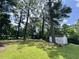 Large backyard with storage shed and mature trees at 109 S Maple Ave., Andrews, SC 29510