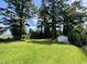 Large green backyard with mature shade trees with shed for storage at 109 S Maple Ave., Andrews, SC 29510