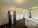 Spacious kitchen with stainless steel refrigerator and ample storage at 109 S Maple Ave., Andrews, SC 29510