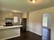Spacious kitchen with stainless steel refrigerator and breakfast bar at 109 S Maple Ave., Andrews, SC 29510
