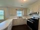 Updated kitchen with tile backsplash and modern appliances at 109 S Maple Ave., Andrews, SC 29510
