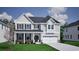 Charming two-story home with gray siding, black shutters and inviting covered front porch at 1114 Laconic Dr., Myrtle Beach, SC 29588