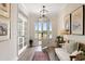 Bright foyer featuring hardwood floors, white trim, and french doors leading to another room at 1114 Laconic Dr., Myrtle Beach, SC 29588