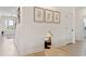Bright hallway features beautiful hardwood floors, neutral walls, and a charming dog house at 1114 Laconic Dr., Myrtle Beach, SC 29588