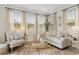 Beautifully staged living room featuring neutral tones, decorative accents, and an abundance of natural light at 1114 Laconic Dr., Myrtle Beach, SC 29588