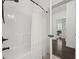 Bathroom featuring a tub with shower and an open doorway to the bedroom at 1188 Peterson St., Myrtle Beach, SC 29577