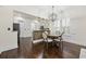 Elegant dining room with round table, upholstered chairs, and a modern chandelier at 1188 Peterson St., Myrtle Beach, SC 29577