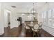 Open-concept dining area connected to a kitchen with a breakfast bar at 1188 Peterson St., Myrtle Beach, SC 29577
