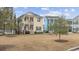 Charming two-story home with a inviting front porch, well-manicured lawn, and classic architectural details at 1188 Peterson St., Myrtle Beach, SC 29577