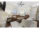 Inviting living room features comfortable seating, a ceiling fan, and beautiful dark wood floors at 1188 Peterson St., Myrtle Beach, SC 29577