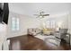 Bright living room with hardwood floors, plantation shutters, and neutral-toned furnishings at 1188 Peterson St., Myrtle Beach, SC 29577