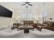 Bright and airy living room features a brown leather sofa and two modern swivel chairs at 1188 Peterson St., Myrtle Beach, SC 29577