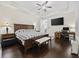 Spacious main bedroom with hardwood floors, tray ceiling, king bed, and a view of the TV at 1188 Peterson St., Myrtle Beach, SC 29577