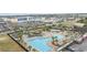 Aerial view of a sprawling community pool featuring multiple pools, a lazy river, lush landscaping, and ample lounging areas at 1188 Peterson St., Myrtle Beach, SC 29577