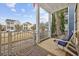 Inviting porch with comfortable seating, decorative rug and attractive neighborhood views at 1188 Peterson St., Myrtle Beach, SC 29577