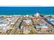 A picturesque aerial view captures oceanfront condos, businesses, and beaches with crystal-clear ocean waters at 120 Dogwood Dr. N # 313, Garden City Beach, SC 29576