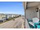 Charming balcony with chairs, coastal decor, and a view of the street at 120 Dogwood Dr. N # 313, Garden City Beach, SC 29576