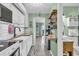 Bright kitchen featuring white cabinets, wood countertops, subway tile backsplash, and stainless steel appliances at 120 Dogwood Dr. N # 313, Garden City Beach, SC 29576