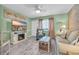 Relaxing living room with a cozy fireplace, coastal-themed accents, and a comfortable seating area at 120 Dogwood Dr. N # 313, Garden City Beach, SC 29576