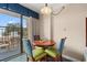 Cozy dining area with round table, three chairs, and access to a private balcony at 1200 North Ocean Blvd. # 206, Myrtle Beach, SC 29577