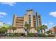 Holiday Pavilion featuring multi-story architecture, balconies, and palm tree landscaping at 1200 North Ocean Blvd. # 206, Myrtle Beach, SC 29577