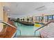Indoor lazy river with lush planters and pool side chairs at 1200 North Ocean Blvd. # 206, Myrtle Beach, SC 29577