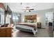 Tranquil bedroom with a wooden headboard, TV, and balcony access at 1217 S Ocean Blvd. # 5, Surfside Beach, SC 29575