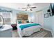 Stylish bedroom with a king-size bed, ceiling fan and a rustic headboard for a unique touch at 1217 S Ocean Blvd. # 5, Surfside Beach, SC 29575