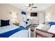 Inviting bedroom featuring two twin beds, a ceiling fan, and ample natural light at 1217 S Ocean Blvd. # 5, Surfside Beach, SC 29575