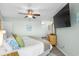 Comfortable bedroom with light green walls and view into en-suite bathroom at 1217 S Ocean Blvd. # 5, Surfside Beach, SC 29575
