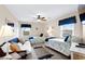Charming bedroom with two twin beds, a cozy daybed, and a ceiling fan for added comfort at 1217 S Ocean Blvd. # 5, Surfside Beach, SC 29575