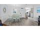 Bright dining area with modern table, stylish chairs, and easy access to the kitchen at 1217 S Ocean Blvd. # 5, Surfside Beach, SC 29575